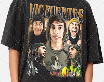 May include: Black t-shirt with a vintage-style graphic featuring multiple images of Vic Fuentes, the lead singer of the band Pierce the Veil. The graphic includes the band's name "Vic Fuentes" in yellow letters.