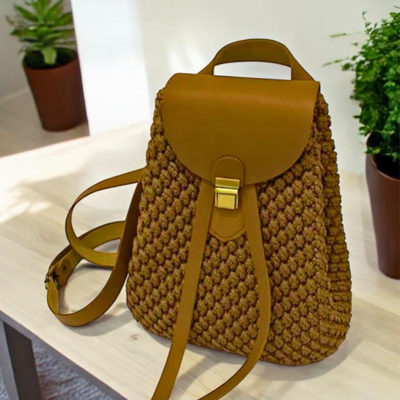 brown faux leather backpack with ivory floral crochet overlay The Sak Sayulita - Hand crocheted and ready to accompany you on any beach day or sunny day around town Crochet Backpack Kit: Beginner-friendly Leather