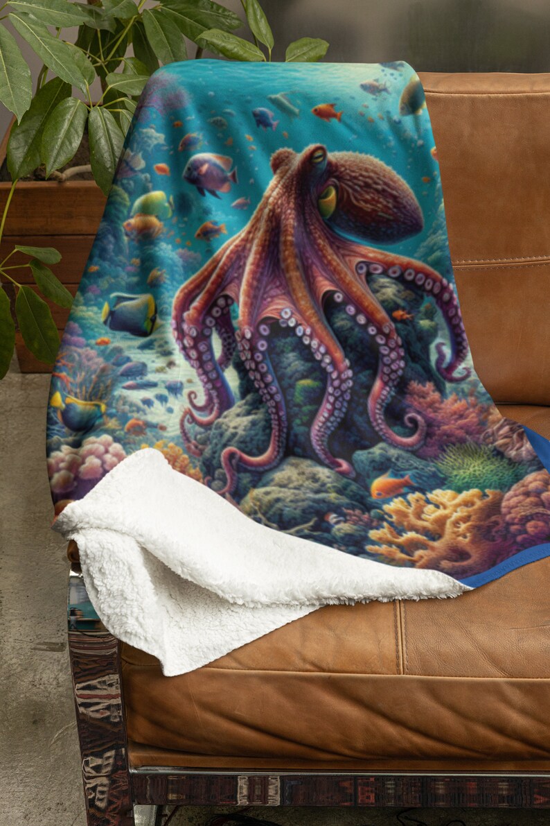 May include: A plush throw blanket featuring a vibrant underwater scene with a large purple octopus resting on a coral reef. The design includes various colorful tropical fish swimming among detailed coral formations in shades of blue, orange, and pink.