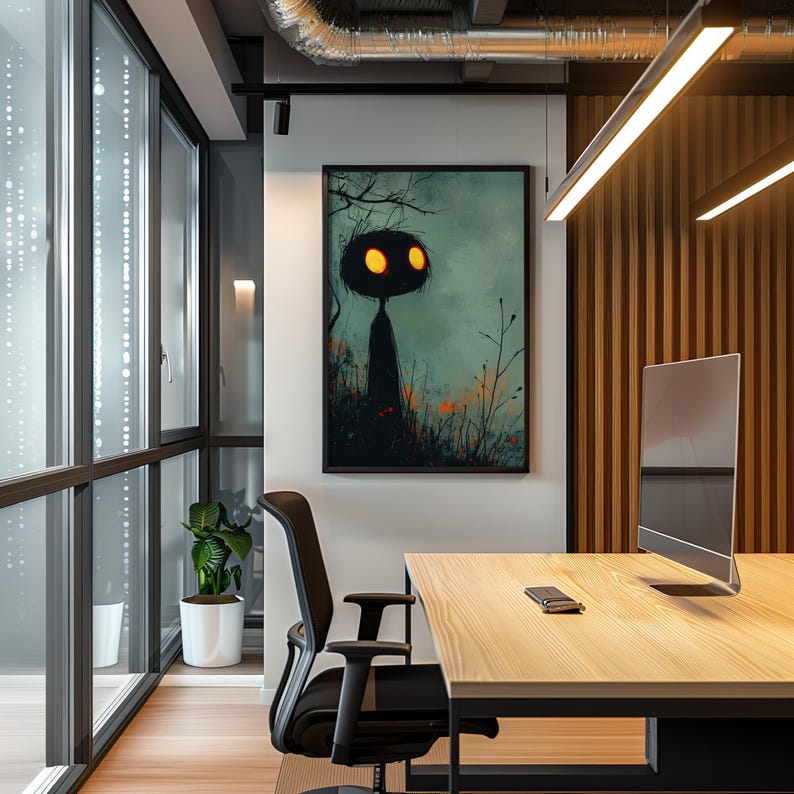 a desk with a computer and a painting on the wall