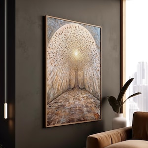 May include: A framed artwork showing a tree with a bright, golden canopy and a textured trunk. The tree is centered in a tunnel-like structure with a stone path. The artwork is in a wooden frame and hangs on a dark wall.