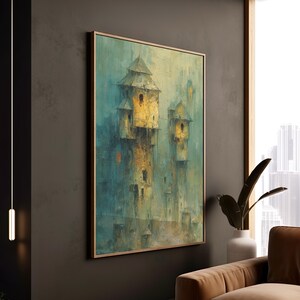 May include: An abstract painting of a castle with multiple towers in shades of yellow, teal, and brown. The artwork is framed in a wooden frame and hangs on a dark gray wall. The painting has a textured, painterly style.