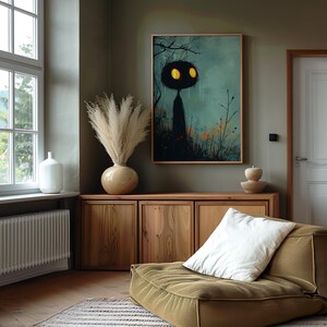 a living room with a couch and a painting on the wall