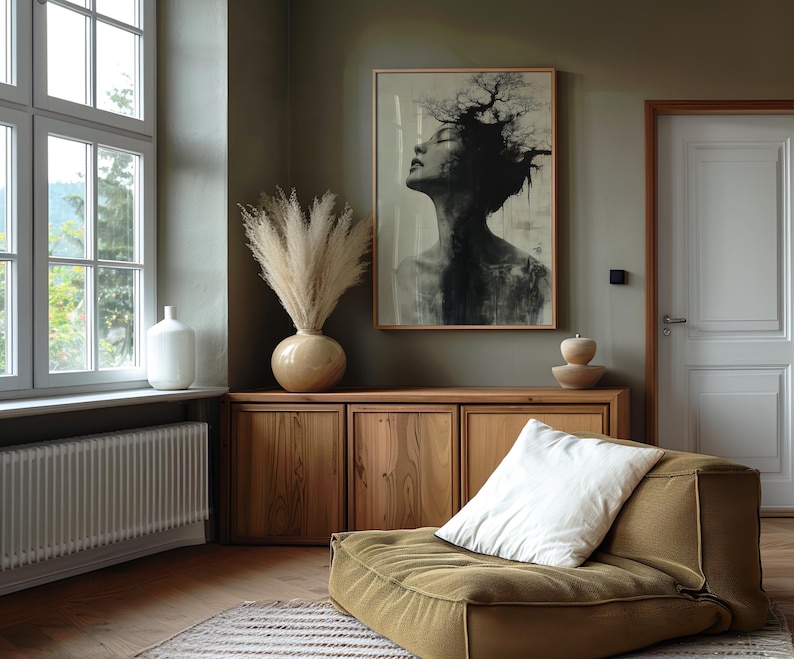 a living room with a couch and a painting on the wall