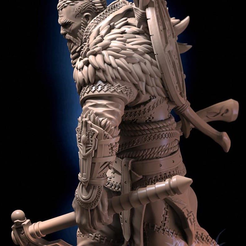 May include: A detailed figurine of a warrior with a beard, wearing a feathered cloak and holding a weapon. The figurine is made of a light brown material and is sculpted in a realistic style.
