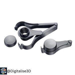 May include: A set of dark gray 3D-printed tools, including a clamp-like device and two circular components. The clamp has curved jaws and a central ring. The circular pieces have textured surfaces. The tools are arranged against a white background.