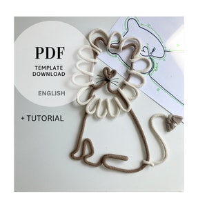 Może przedstawiać: Pobieralne PDF z szablonem lwa wykonanego z sznurka. Szablon zawiera samouczek i instrukcje tworzenia lwa. Lew jest wykonany z dwóch kolorów sznurka, brązowego i białego.