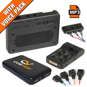 May include: A black Cosvox voice pack with various components, including a speaker, remote control, and power bank. The speaker has a grid of holes and the text "Cosvox". The image also includes an MP3 icon.