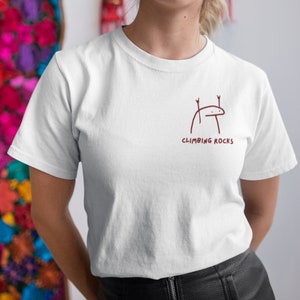 Minimalistic White cotton rock climbing t shirt with embroidery for rock climbers that says climbing rocks