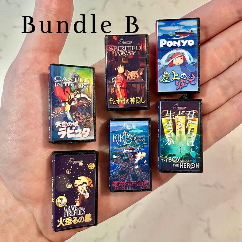 May include: A selection of small movie cases with vibrant artwork from animated films. Titles such as "Spirited Away," "Ponyo," and "Grave of the Fireflies" are visible. The text "Bundle B" is at the top.