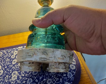 Lampada da tavolo in vetro isolante