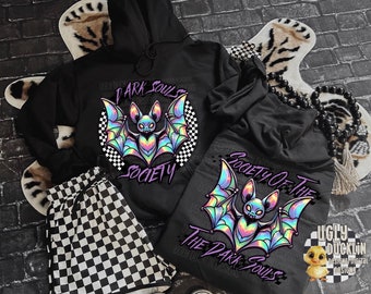 May include: Two black hoodies with a holographic bat graphic and the text "Dark Souls Society" and "Society of the Dark Souls".