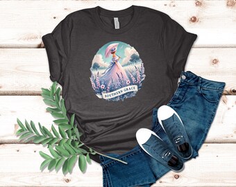 Elegant Southern Belle Graphic T-Shirt Graceful Lady in Wildflower Field with Parasol and Pastoral Charm