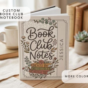 May include: A custom book club notebook with the words "Book Club Notes" in a decorative font. The cover features floral and leaf accents, a stack of books, and the name "Jessica". The notebook is open, revealing blank pages.