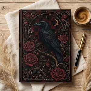 May include: A rectangular hardcover journal featuring a black raven perched on a branch, surrounded by deep red roses and intricate gold filigree. The background displays a dark red and black checkered pattern with a small golden crescent moon.