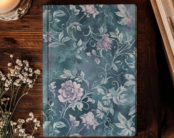 May include: A rectangular notebook featuring a dark teal background with a repeating pattern of light purple and white floral illustrations, including detailed roses, swirling vines, and leaves across the entire front cover surface.