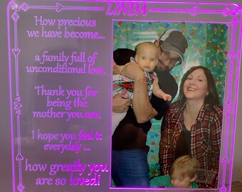 May include: A purple LED light with a picture frame that says "How precious we have become... a family full of unconditional love. Thank you for being the mother you are. I hope you feel it everyday... how greatly you are so loved!" and "LINDA" at the top. The picture frame has a family photo inside.