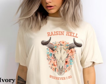 Raisin' Hell Western mucca teschio Tee Boho Western t-shirt mucca teschio camicia camicia occidentale camicia paese unico selvaggio West Western grafica t-shirt