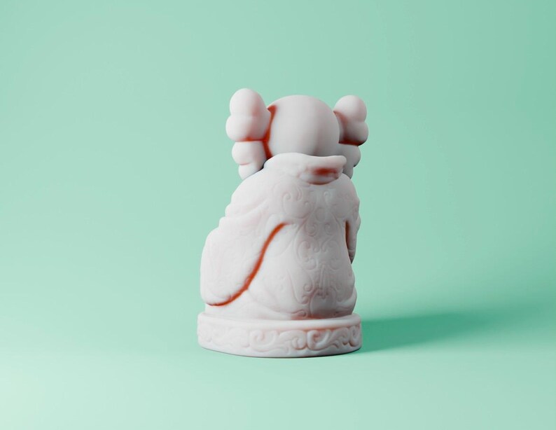 May include: White ceramic figurine of a cartoon character with large ears and a rounded body. The figurine is sitting on a base with a decorative design.