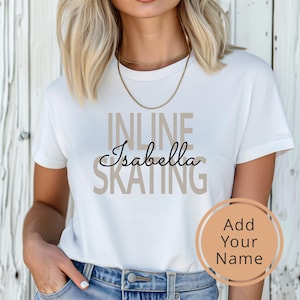 May include: White t-shirt with the text "INLINE" and "SKATING" in beige, and the name "Isabella" in black cursive.