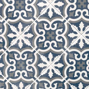 May include: A repeating pattern of blue, white, and gray ceramic tiles with a geometric design. The tiles have a distressed look, giving them a vintage feel.