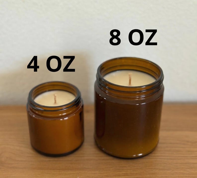 two brown glass jars, one larger and one smaller, placed on a wooden surface. Above the jars, there are two black text labels indicating the size of the jars: "4 OZ" and "8 OZ".