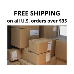 a large stack of cardboard boxes, with a sign that reads "FREE SHIPPING on all U.S. orders over $35".