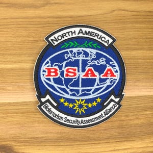 Toppa anti-bioterrorismo BSAA Nord America - Accessorio per cosplay di Resident Evil (3,5x3,25)