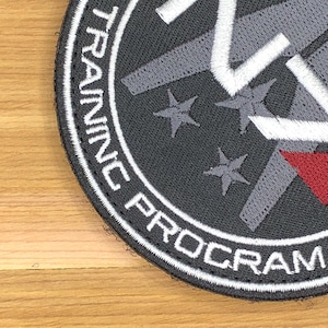Program szkoleniowy sił specjalnych Sojuszu, cosplay komandora Sheparda, odznaka morale w grach science fiction, naszywka taktyczna N7