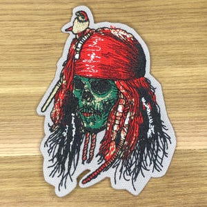 Parche de calavera del Capitán Jack Sparrow - Insignia de moral pirata del Caribe