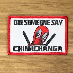 May include: Embroidered patch with a red border and a white background. The patch features the Deadpool character's face in red and gray, with the text "DID SOMEONE SAY CHIMICHANGA" in black.
