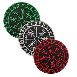 May include: Three circular embroidered patches featuring the Vegvisir symbol. The patches are black with the Vegvisir symbol in green, white, and red. The Vegvisir symbol is a Viking compass used as a guide for those who have lost their way.