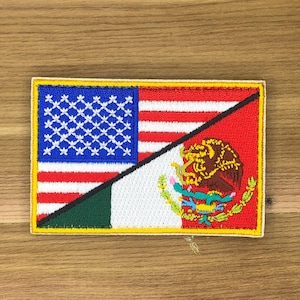May include: Embroidered patch featuring a split design of the American and Mexican flags. The American side displays a blue field with white stars and red and white stripes. The Mexican side shows the coat of arms and green, white, and red colors.