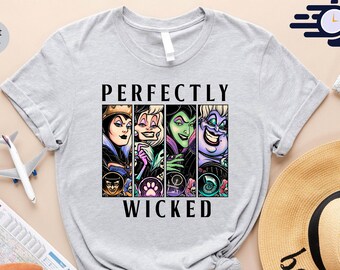 May include: Light gray t-shirt featuring the phrase "Perfectly Wicked" with images of four cartoon villains. The shirt is surrounded by travel accessories, including a straw hat, map, and passport.