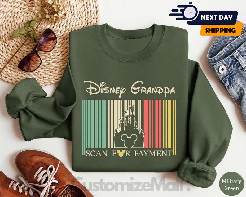 a green sweatshirt with a Disney Grandpa design, a pair of sunglasses, a woven basket, a pair of brown shoes, and a pair of jeans, all arranged on a white background.