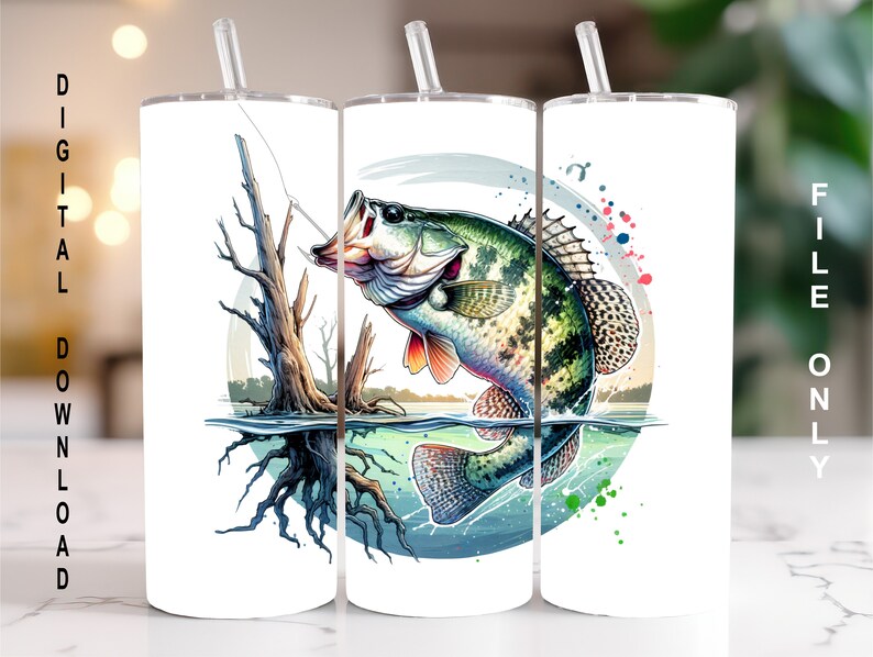 May include: Three white tumblers with a colorful design of a fish jumping out of the water. The fish is green, brown, and white with a splash of color behind it. The design is surrounded by a circle with a blue, green, and white background.