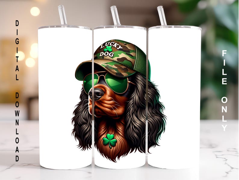May include: A white tumbler with a graphic of a brown and black dog wearing a green camouflage hat with the words "Lucky Dog" on it. The dog is also wearing green sunglasses and a shamrock.