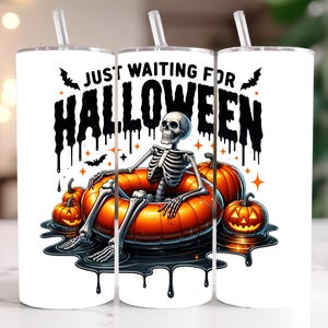 May include: White tumbler with a black and white illustration of a skeleton sitting in a floating orange ring with pumpkins around it. The text "Just Waiting For Halloween" is written in black dripping letters.