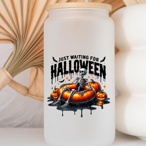 May include: White frosted glass water bottle with a bamboo lid and a black and orange graphic of a skeleton in a pumpkin-shaped inner tube. The graphic says "Just Waiting for Halloween".