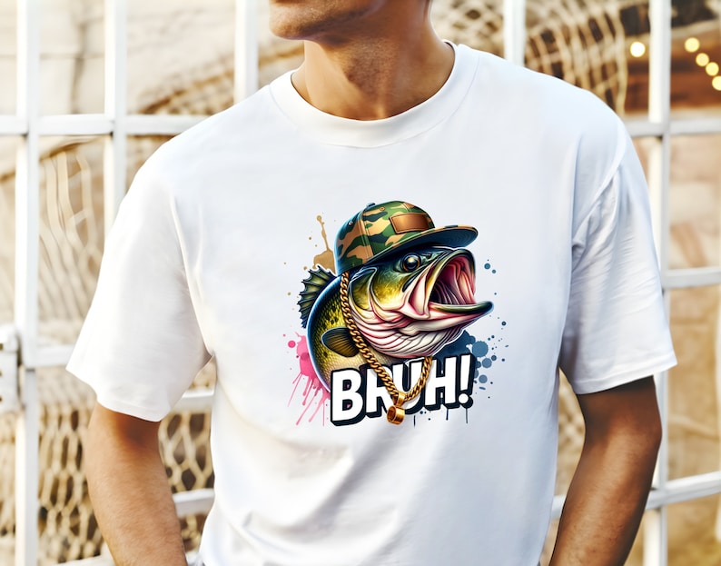 May include: White t-shirt featuring a cartoon bass wearing a camouflage cap and gold chain. The fish has an open mouth and the word "BRUH!" in a bold font. Colorful paint splatters surround the fish.