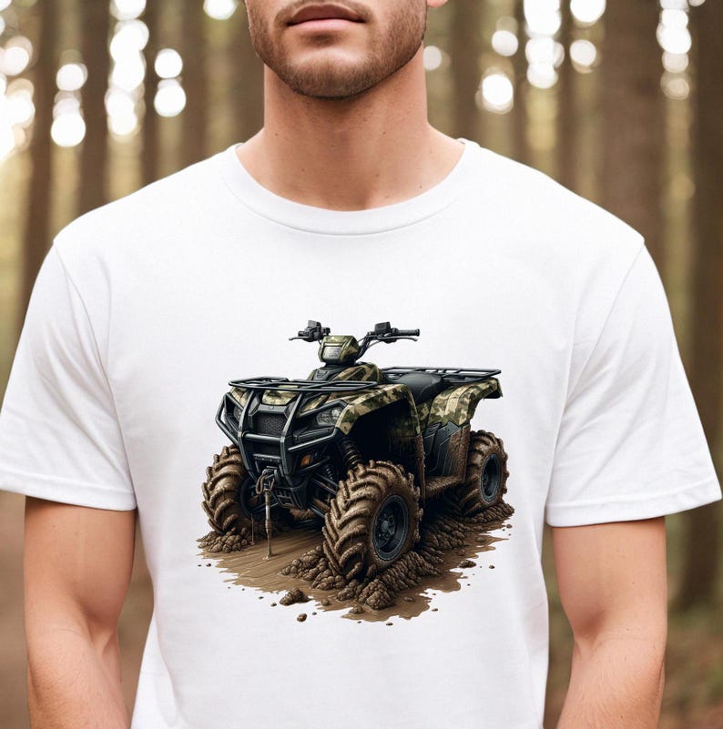 May include: White t-shirt with a graphic of a camouflage ATV driving through mud.