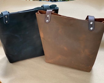 Leather tote bags with inside pockets. medium size. 13”Wx12”Hx2.75”D.