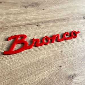 Bronco Wing Red Lettering Emblem