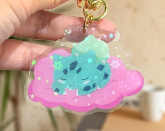 Llavero de Bulbasaur de Pokémon – Durmiendo en las nubes, regalo de acrílico para gamers