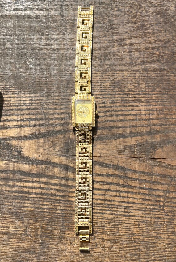 Vintage working adjustable gold tone quartz watch 