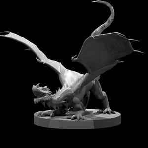May include: A grayscale 3D-printed dragon figurine. The dragon is depicted in a dynamic pose, with its wings spread and mouth open. The figurine is detailed, showing scales, claws, and a long tail. It is mounted on a circular base.