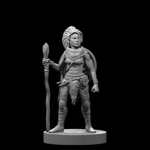 May include: A gray miniature figurine of a warrior standing on a circular base. The figure has a high ponytail, wears a scarf, a loincloth, and leg wraps, and holds a tall staff in the right hand while carrying a round shield on the back.