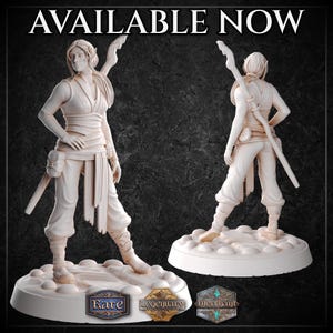 May include: A white painted miniature figurine of a female character with a staff and a pouch. The figurine is posed in a dynamic stance with one leg forward and the other leg back. The figurine is standing on a circular base.