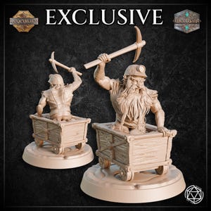 May include: Two beige-colored figurines of bearded miners in wooden carts, wielding pickaxes. The figurines are on circular bases. The word "EXCLUSIVE" is at the top of the image.