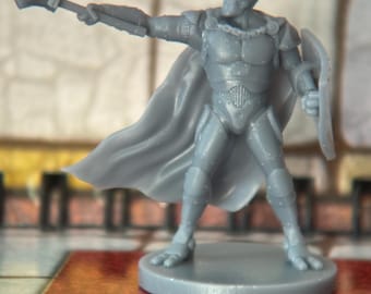 May include: A gray miniature figurine of a knight in armor, holding a mace and shield. The knight has a flowing cape and is standing on a circular base. The figurine is likely for a tabletop game.